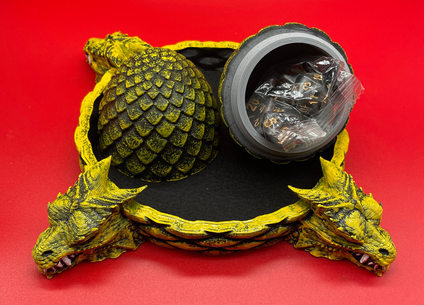 Lord Elemere's Dragon Egg Dice Shaker and tray with matching dice. Yellow / Black Version