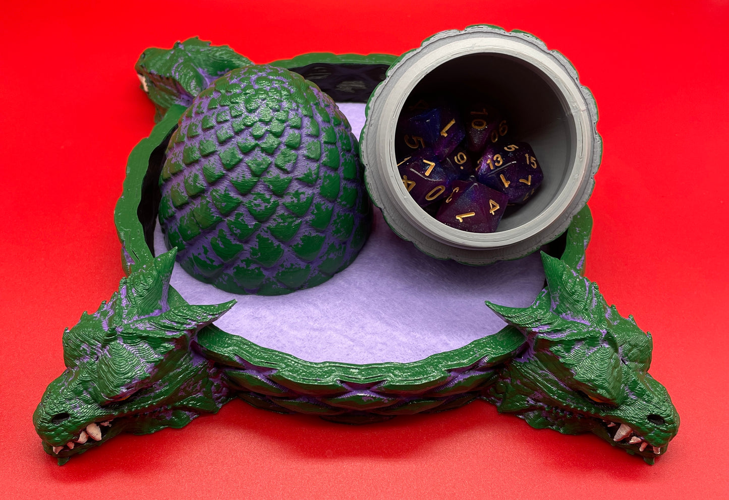 Lord Elemere's Dragon Egg Dice Shaker and tray with matching dice. Purple / Green version