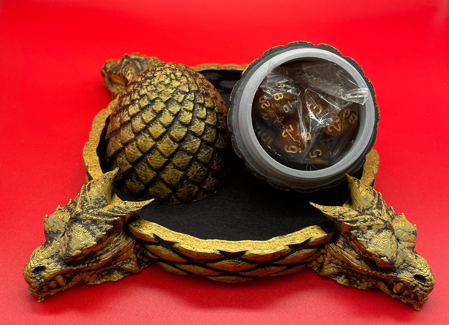 Lord Elemere’s Dragon Egg Dice Shaker and tray with matching dice. Black / Gold version