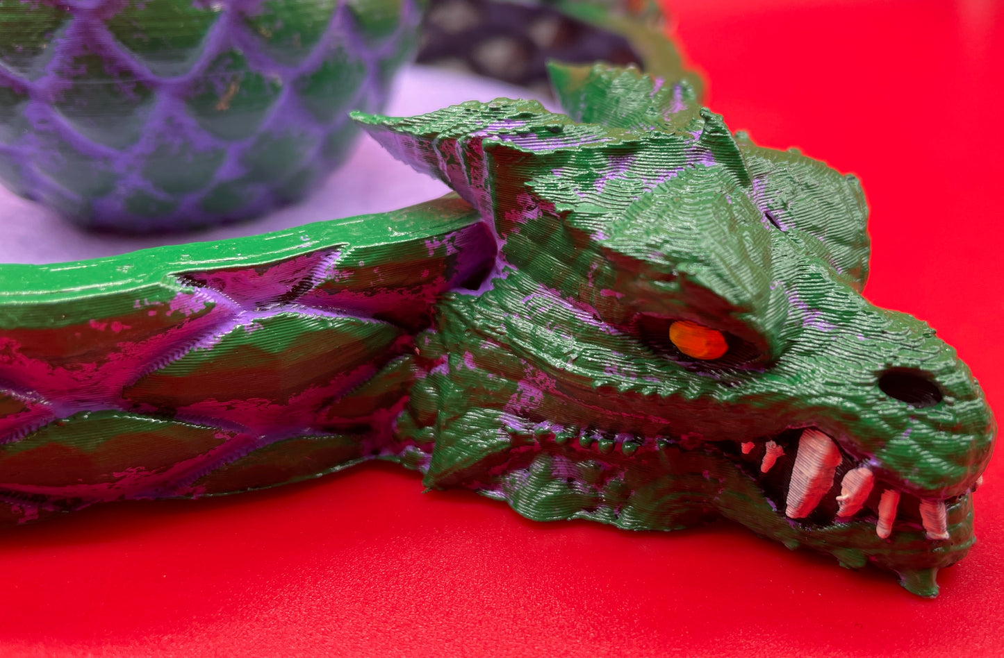 Lord Elemere's Dragon Egg Dice Shaker and tray with matching dice. Purple / Green version